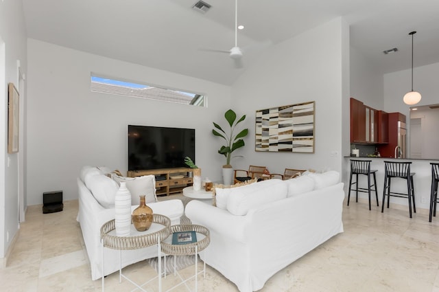 6247 NW 33rd Ave, Boca Raton, FL 33496 - living room with a skylight, visible vents, and high vaulted ceiling