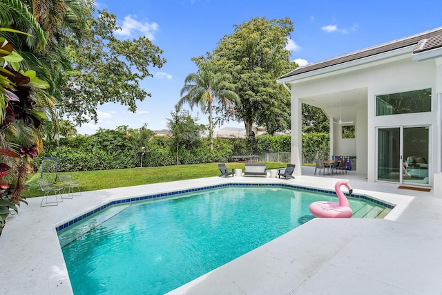 6247 NW 33rd Ave, Boca Raton, FL 33496 - view of pool featuring a lawn, a patio area, and a fenced in pool