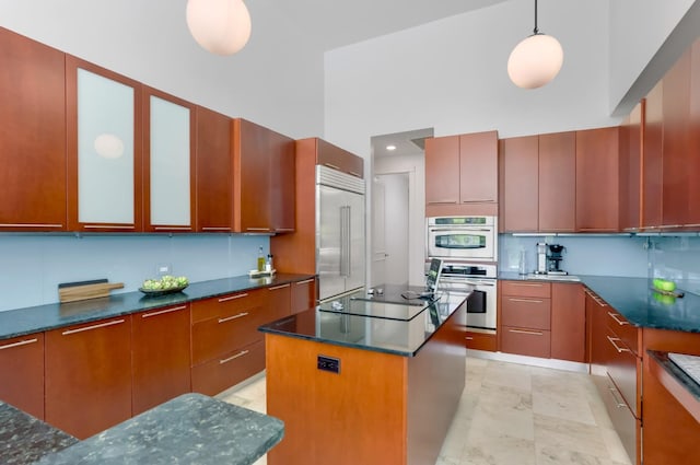 6247 NW 33rd Ave, Boca Raton, FL 33496 - kitchen featuring a center island, stainless steel appliances, and modern cabinets