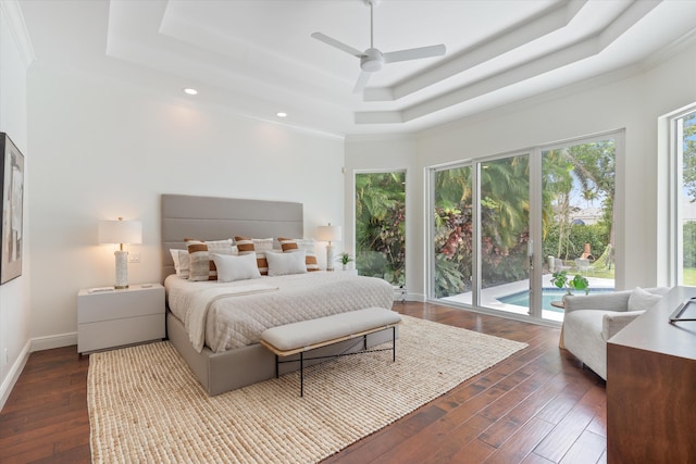 6247 NW 33rd Ave, Boca Raton, FL 33496 - bedroom featuring recessed lighting, dark wood-style floors, a raised ceiling, access to exterior, and baseboards