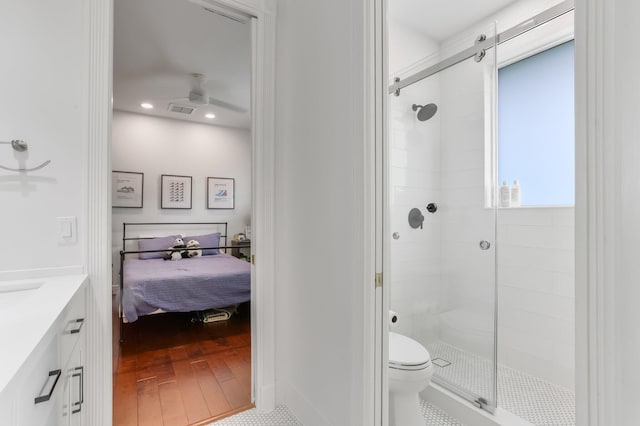 6247 NW 33rd Ave, Boca Raton, FL 33496 - ensuite bathroom with a shower stall, vanity, ensuite bath, toilet, and visible vents