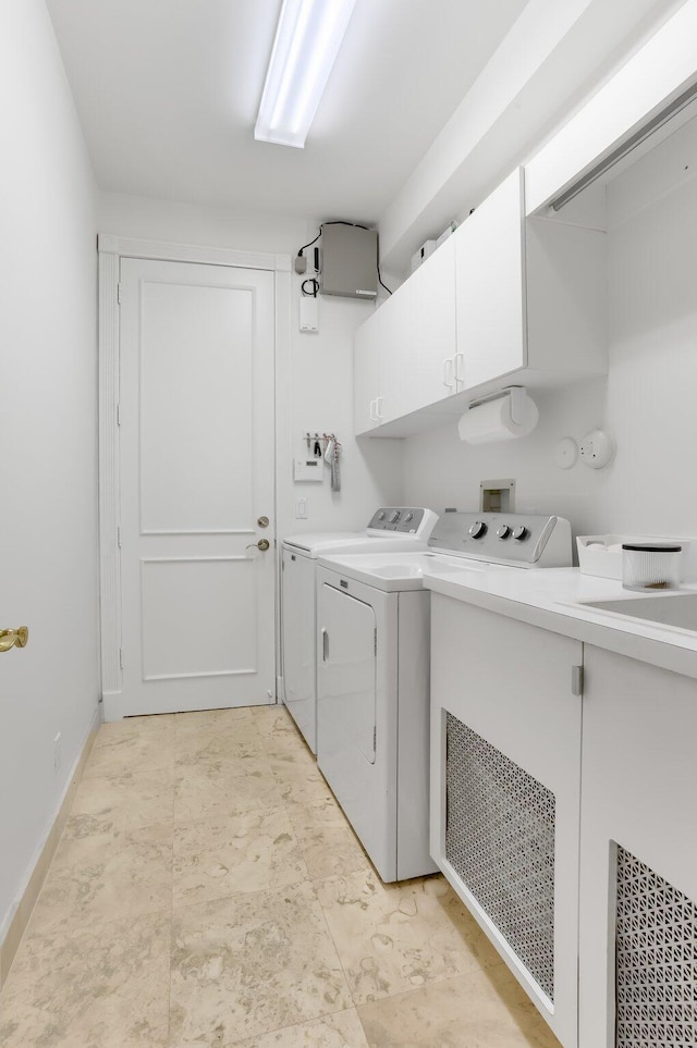6247 NW 33rd Ave, Boca Raton, FL 33496 - clothes washing area with cabinet space, washing machine and clothes dryer, and baseboards