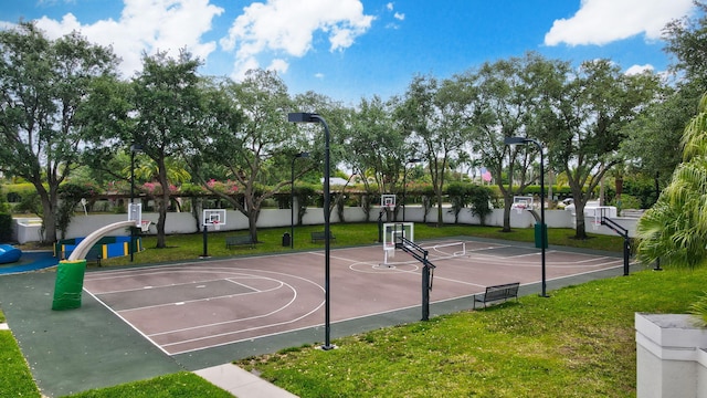 6247 NW 33rd Ave, Boca Raton, FL 33496 - view of sport court featuring community basketball court, fence, and a yard
