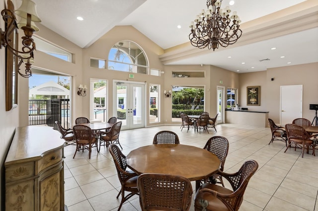 6247 NW 33rd Ave, Boca Raton, FL 33496 - dining space featuring french doors, light tile patterned flooring, visible vents, a notable chandelier, and high vaulted ceiling