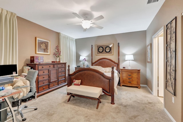 carpeted bedroom featuring ceiling fan, visible vents, and baseboards