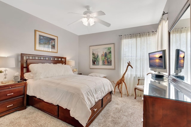 bedroom featuring ceiling fan and light carpet