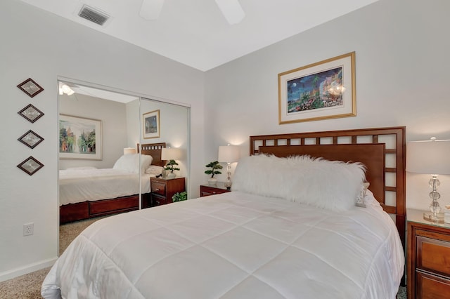 bedroom featuring visible vents, ceiling fan, a closet, and carpet floors