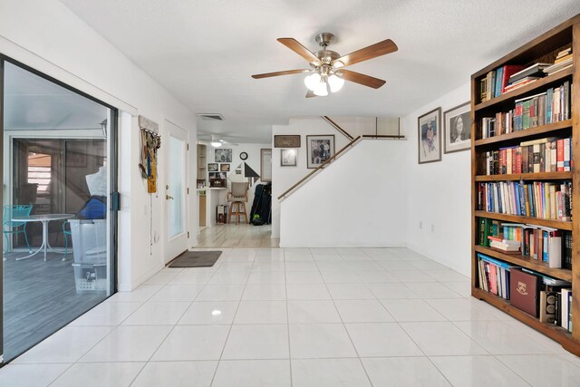 interior space featuring a ceiling fan and visible vents