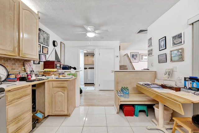 kitchen with a ceiling fan, decorative backsplash, independent washer and dryer, and light brown cabinets