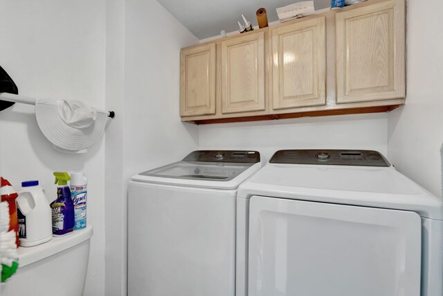 laundry room with cabinet space and independent washer and dryer