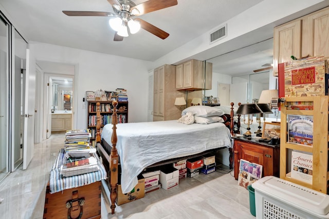 bedroom with visible vents, a ceiling fan, and marble finish floor