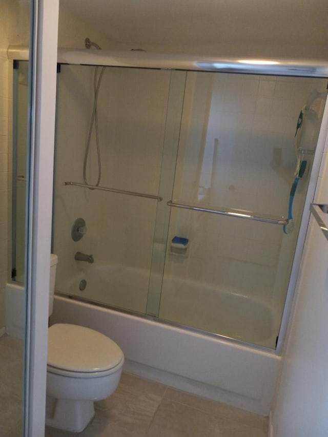 1213 12th Ter, Palm Beach Gardens, FL 33418 - full bathroom with toilet, shower / bath combination with glass door, and tile patterned flooring