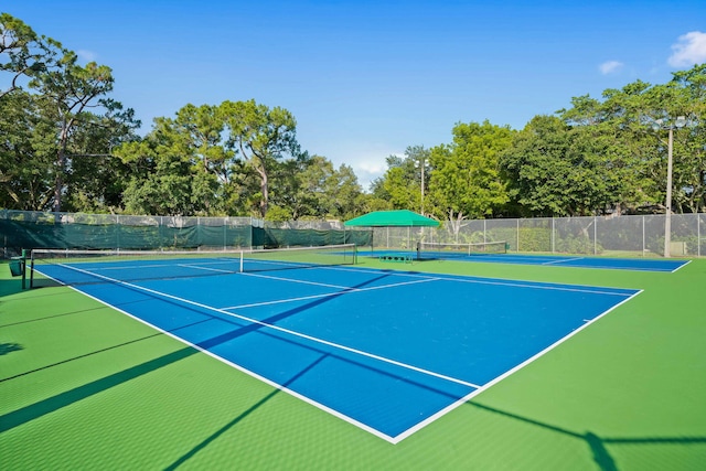 view of sport court with community basketball court and fence