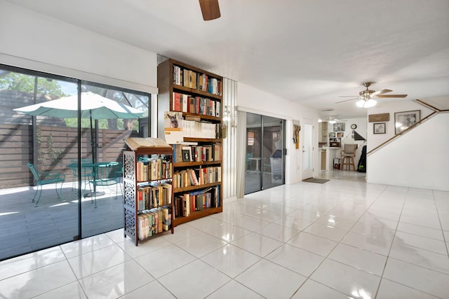 interior space featuring a ceiling fan and light tile patterned floors