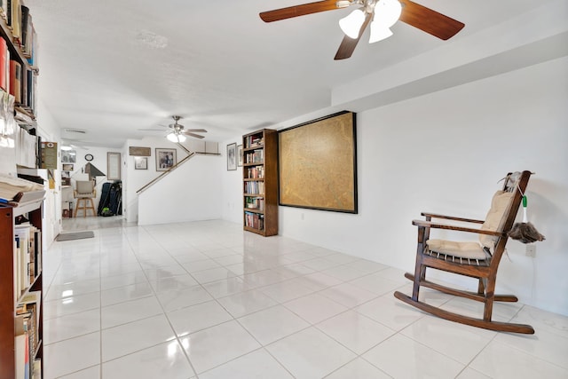 unfurnished room featuring ceiling fan and light tile patterned flooring