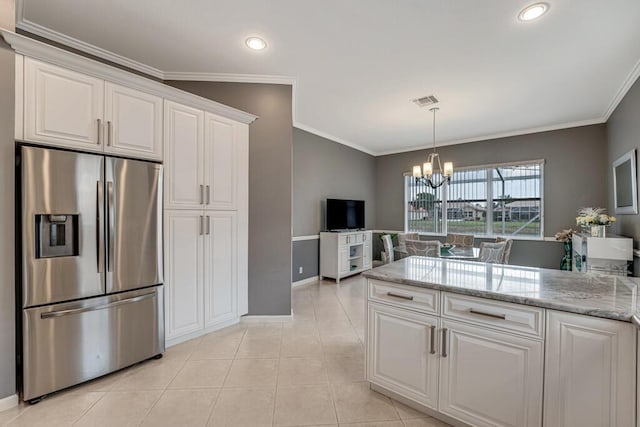 kitchen featuring crown molding, baseboards, an inviting chandelier, and stainless steel fridge with ice dispenser