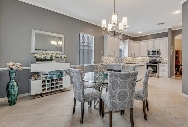 dining area featuring baseboards, visible vents, a notable chandelier, ornamental molding, and light tile patterned floors