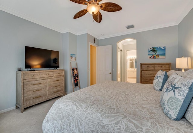 bedroom featuring light tile patterned flooring, arched walkways, baseboards, ornamental molding, and visible vents