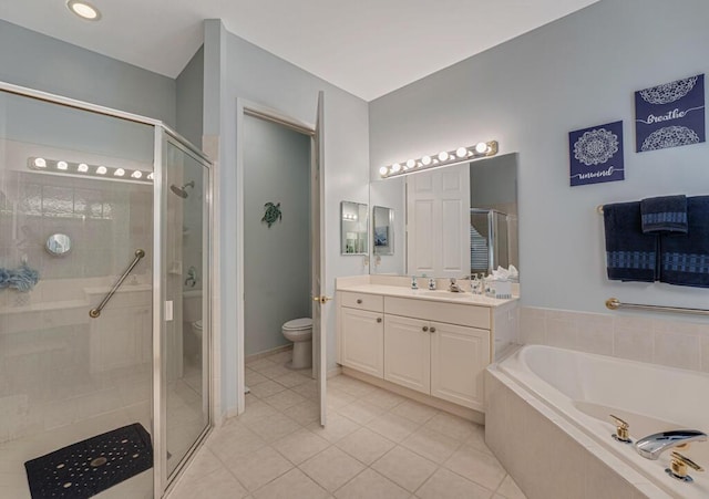 bathroom featuring toilet, a stall shower, tile patterned flooring, a garden tub, and vanity