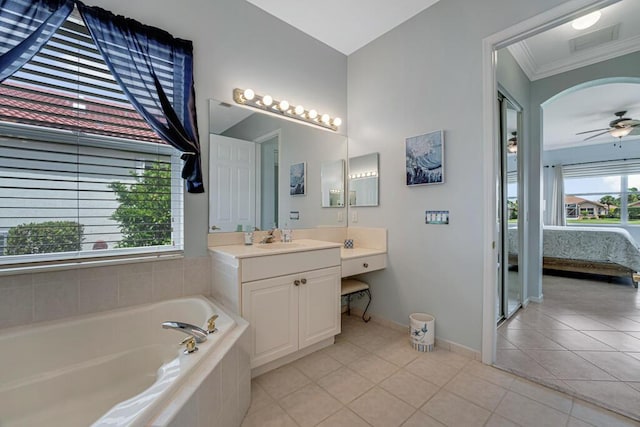 full bathroom featuring tile patterned floors, visible vents, vanity, a bath, and ensuite bath