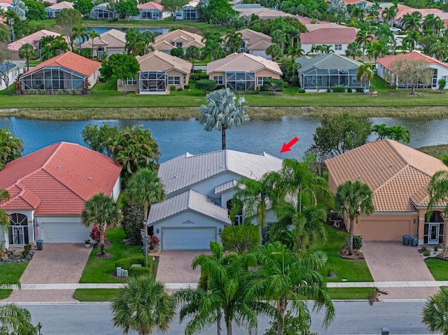 bird's eye view with a water view and a residential view