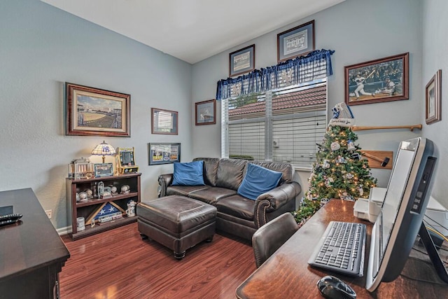 living room featuring baseboards and wood finished floors