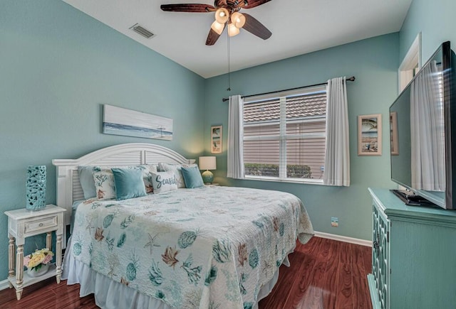 bedroom with visible vents, a ceiling fan, baseboards, and dark wood-style flooring