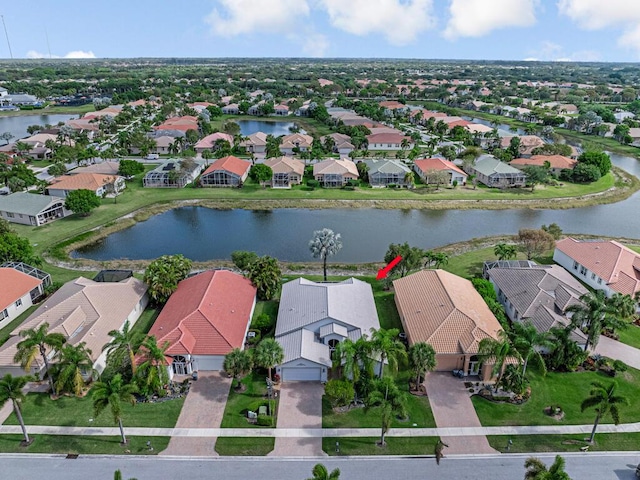 bird's eye view featuring a water view and a residential view
