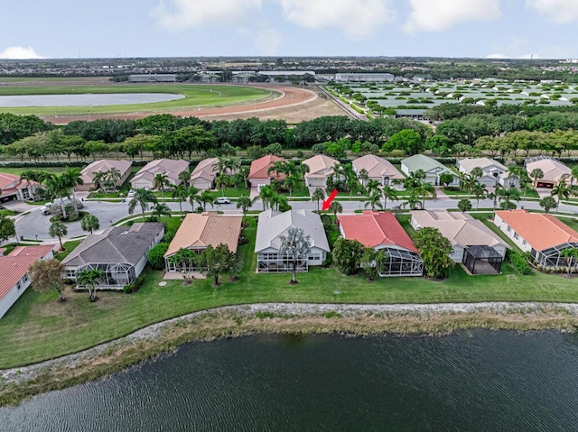 birds eye view of property with a residential view and a water view