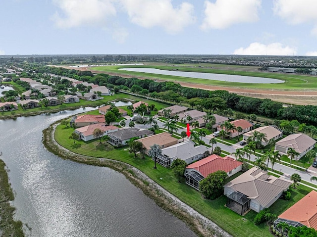 aerial view with a water view and a residential view