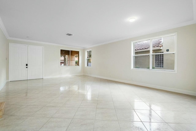 865 Gazetta Way, West Palm Beach, FL 33413 - unfurnished room with light tile patterned flooring, visible vents, crown molding, and baseboards