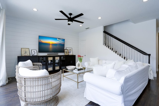 living room with a ceiling fan, recessed lighting, and wood finished floors