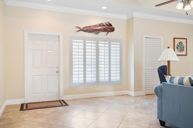 4732 SE Starling Cir, Stuart, FL 34997 - entryway featuring light tile patterned floors, ceiling fan, ornamental molding, and baseboards