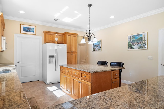 4732 SE Starling Cir, Stuart, FL 34997 - kitchen with recessed lighting, crown molding, decorative light fixtures, light stone counters, and white appliances