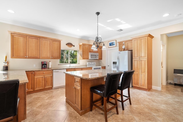 4732 SE Starling Cir, Stuart, FL 34997 - kitchen with visible vents, white appliances, ornamental molding, and a center island