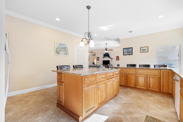 4732 SE Starling Cir, Stuart, FL 34997 - kitchen featuring recessed lighting, light stone countertops, a ceiling fan, pendant lighting, and ornamental molding