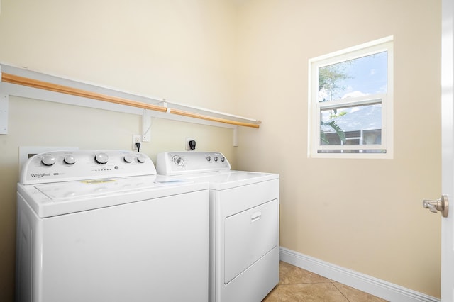 4732 SE Starling Cir, Stuart, FL 34997 - washroom with light tile patterned floors, washing machine and clothes dryer, laundry area, and baseboards
