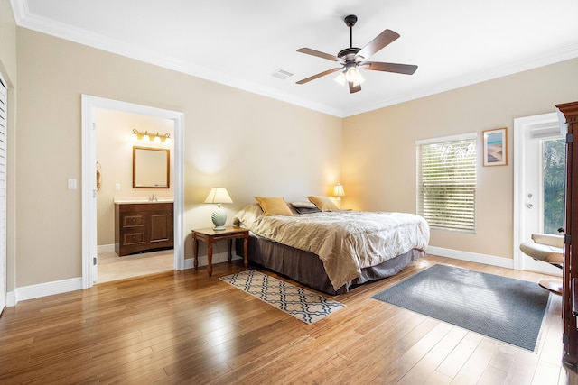 4732 SE Starling Cir, Stuart, FL 34997 - bedroom featuring wood finished floors, visible vents, ornamental molding, and baseboards