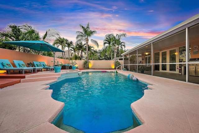 view of swimming pool featuring a fenced in pool, a fenced backyard, and a patio area