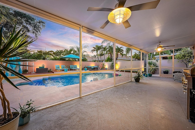 pool at dusk featuring a patio, a fenced in pool, a ceiling fan, and a fenced backyard
