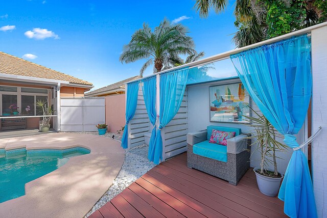 outdoor pool featuring fence