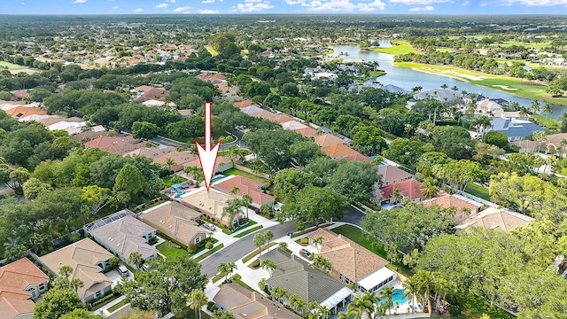 aerial view of residential area featuring a nearby body of water