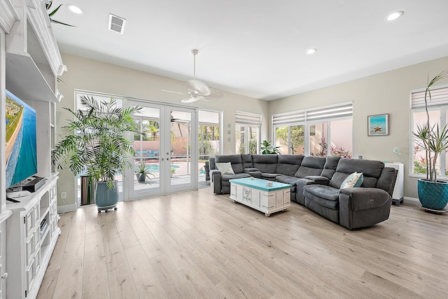 living area with visible vents, recessed lighting, french doors, a ceiling fan, and light wood finished floors
