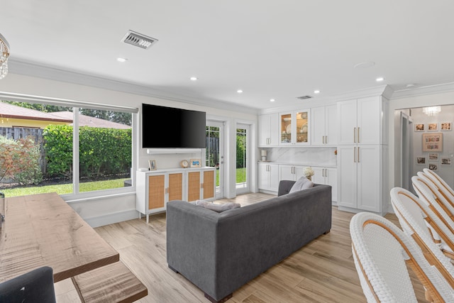 912 Roberts Rd, Delray Beach, FL 33483 - living area featuring visible vents, light wood finished floors, crown molding, and recessed lighting