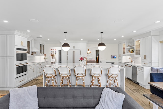 912 Roberts Rd, Delray Beach, FL 33483 - kitchen with white cabinetry, white appliances, a kitchen breakfast bar, and light countertops