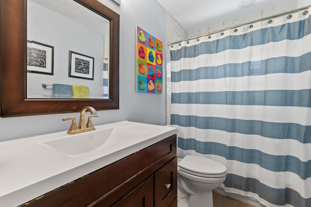912 Roberts Rd, Delray Beach, FL 33483 - full bathroom with curtained shower, wood finished floors, toilet, and vanity