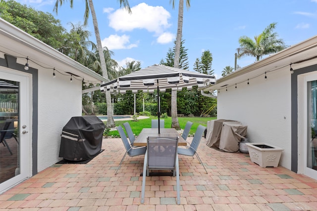 912 Roberts Rd, Delray Beach, FL 33483 - view of patio featuring area for grilling, outdoor dining area, and an outdoor pool