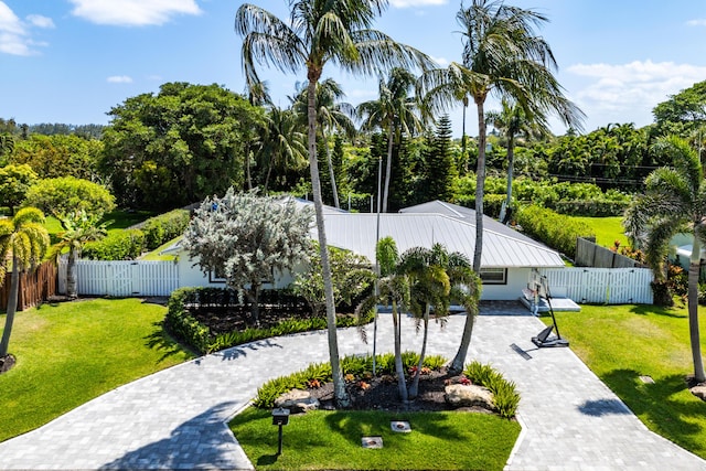 912 Roberts Rd, Delray Beach, FL 33483 - view of community with fence private yard, decorative driveway, and a yard