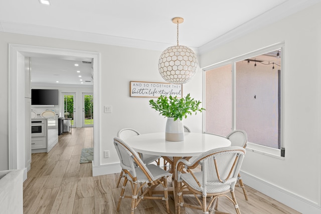 912 Roberts Rd, Delray Beach, FL 33483 - dining room featuring recessed lighting, ornamental molding, light wood finished floors, baseboards, and french doors