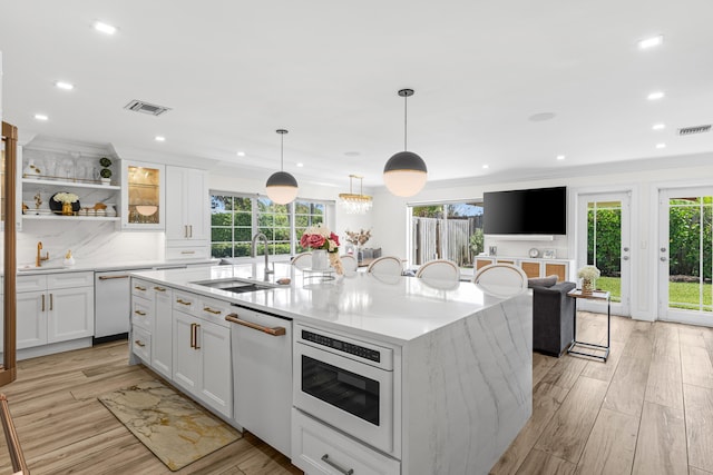 912 Roberts Rd, Delray Beach, FL 33483 - kitchen featuring visible vents, white dishwasher, and a sink